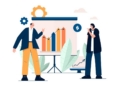 Dos personas discutiendo gráficos de inversión en un entorno de oficina